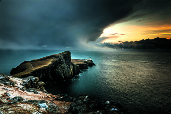 The lighthouse and foghorn at Neist Point on the Isle of Skye look out into the lonely Atlantic Ocean