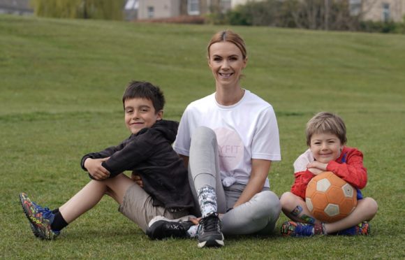 Lisa Kitching with her two sons Joseph and Leo