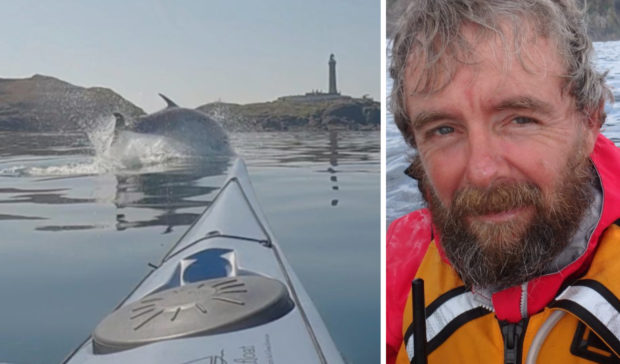 A dolphin frolics around Nick Ray’s kayak as it approaches Ardnamurchan Lighthouse, Lochaber, in video that went around the world last week