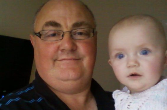 Neil Alexander with baby granddaughter Natalia before he contracted Covid
