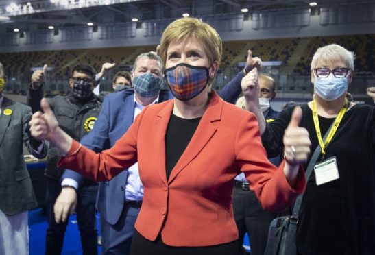 First Minister and SNP party leader Nicola Sturgeon celebrates after retaining her seat for Glasgow Southside