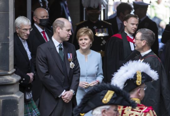 First Minister Nicola Sturgeon looks on as Prince William arrives to speak at the General Assembly of the Church of Scotland in Edinburgh yesterday