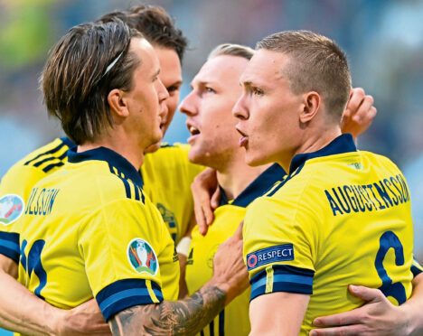 Three of Sweden’s ‘Foreign Legion’ – (from left) Kristoffer Olsson of Krasnodar, RB Leipzig’s Emil Forsberg and Ludwig Augustisson of Werder Bremen – celebrate their opening goal against Poland on their way to winning Group E at the Euros.