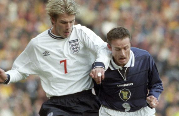 Kevin Gallacher tussles with David Beckham at the Euro 2000 Play-off at Hampden in 1999