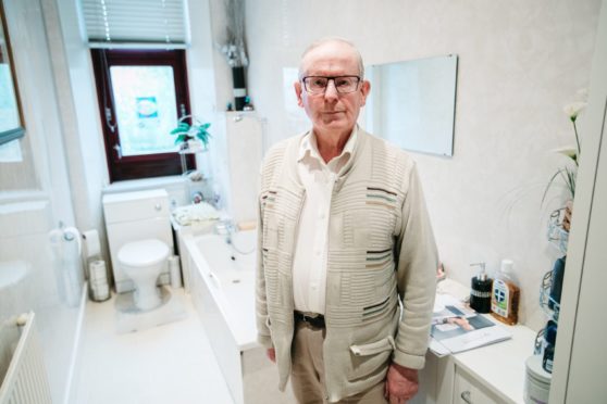 Sepsis survivor William Webster in his bathroom