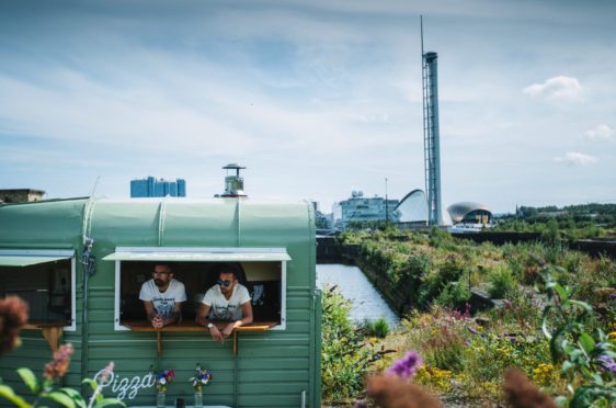 Brothers Ryan and Jay Bharaj in their van,                    Dough Man’s Land, a converted horse box, which they set up in Glasgow’s Finnieston area