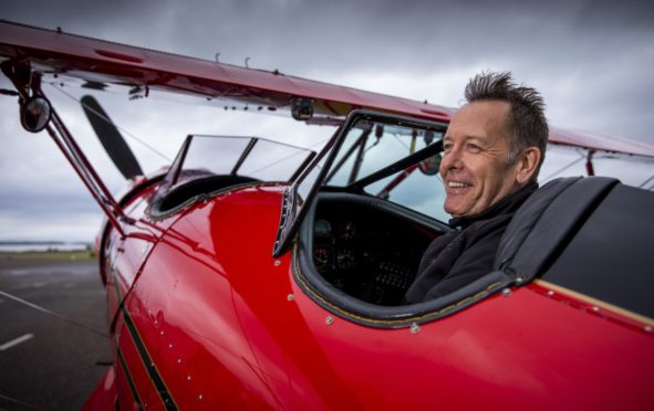 Archie Dudgeon with his beloved Red Byron in Oban