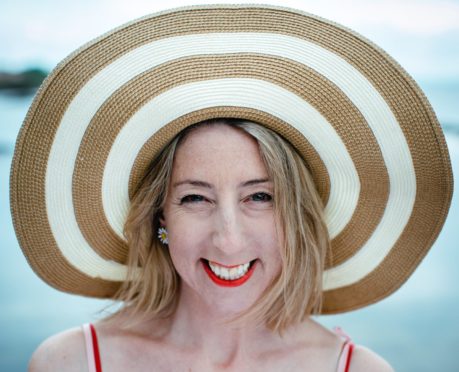 Jenny Colgan, on the beach near her home in Aberdour, Fife.