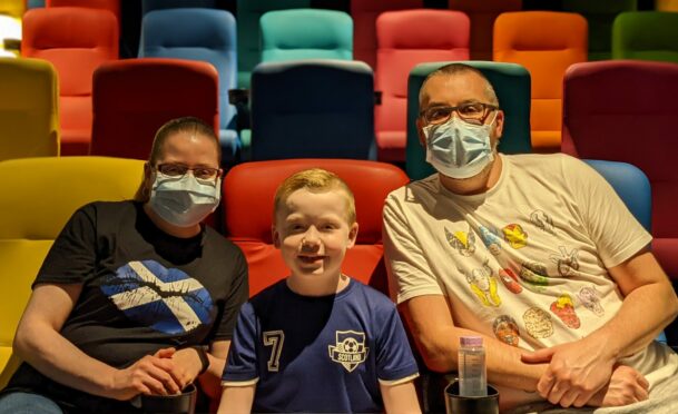 Nine-year-old Riley with parents Louise and David