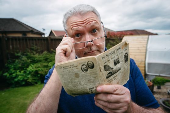 Stephen Lees, with a special limited edition miniature Sunday Post newspaper from 1933, which he found in his late father's belongings