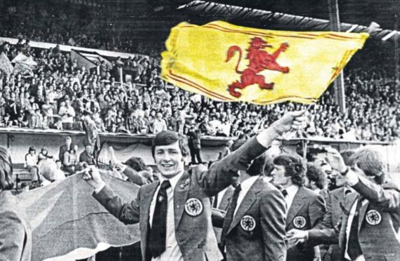 Bruce Rioch flies the flag as Ally MacLeod’s squad wave goodbye to 30,000 fans at Hampden stadium in Glasgow as they head off to the 1978 World Cup in Argentina with high hopes