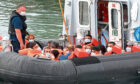 A Border Force vessel brings in migrants found off the coast of Dover in Dover, Kent.