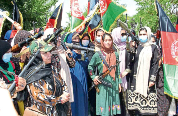 Armed women demonstrate against a resurgent Taliban in Ghor province, central Afghanistan last week