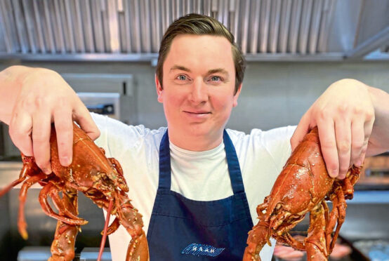 Masterchef star Dean Banks with lobsters