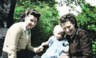 Margaret, left, and Maureen holding son Roddy in 1948
