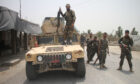 Afghan security force members take part in a military operation against Taliban militants