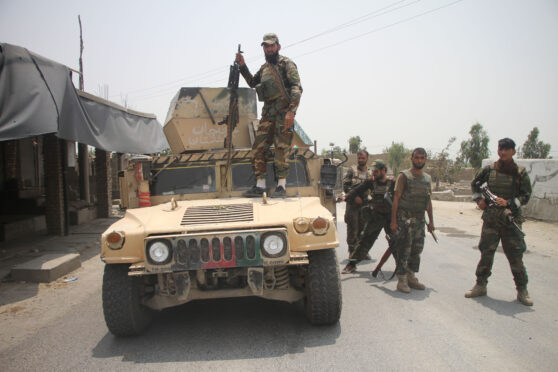 Afghan security force members take part in a military operation against Taliban militants