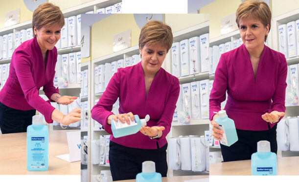 Nicola Sturgeon washes hands on visit to NHS24 contact centre in March