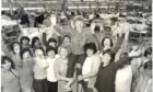 Shop steward Helen Monaghan is raised aloft by her colleagues at the Lee factory in 1981 after their 196-day occupation saved the factory shop
