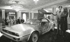 John Z. Delorean and his wife Christina, of Detroit, stand by his prototype car, Model 12, that was unveiled in New Orleans.