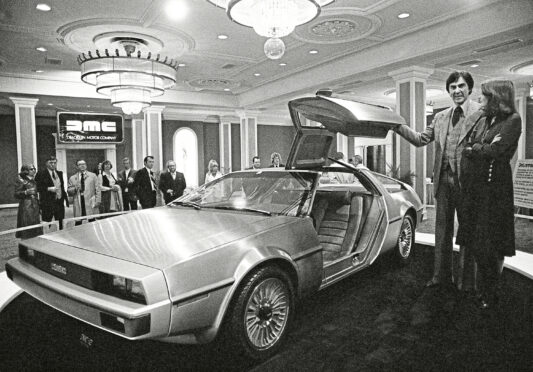 John Z. Delorean and his wife Christina, of Detroit, stand by his prototype car, Model 12, that was unveiled in New Orleans.