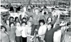 Helen Monaghan celebrates on the shoulders of colleagues at the Lee Jeans factory, Greenock, in 1981