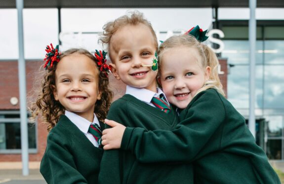 Triplets Alyssia, Caleb and Poppy Stirrat in their new uniforms and about to start school, at St Eunan’s Primary in Clydebank