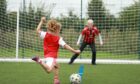 Maya Sher takes a shot as Judy Murray keeps goal at Lewes FC as she was filming Driving Force last week