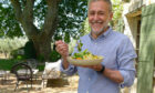 Michel Roux in the villa garden eating his salade compose dish on his new series