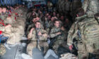 UK military personnel onboard an aircraft departing Kabul