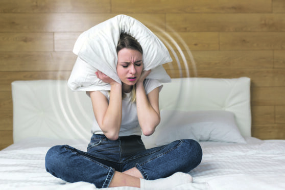 A woman suffering from tinnitus