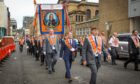 Members of the County Grand Orange Lodge take part in the annual Orange walk parade which passed though the city centre on September 18, 2021 in Glasgow.