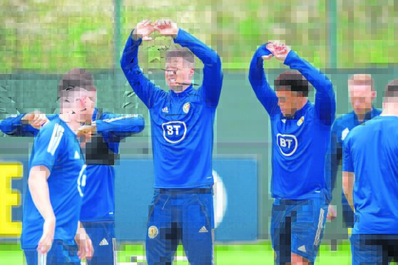 Hands up if you can score against Israel. Lyndon Dykes and Che Adams, seen in training, will be hoping Eran Zahavi won’t be celebrating at Hampden again.