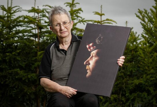 Dagmar with a picture of Brian, a former Gordon Highlander, at her home in Portsoy