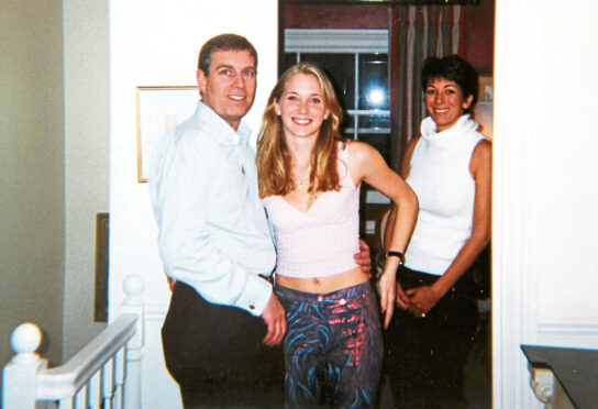 Prince Andrew and Virginia Roberts, aged 17, and Ghislaine Maxwell at Ghislaine Maxwell's townhouse in London in 2001.