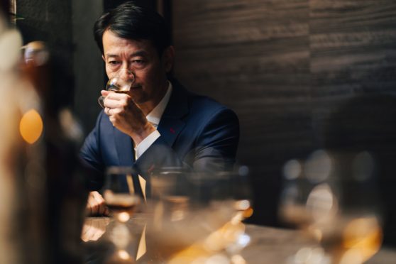 Koji Shimaoka, founder of the new Komoro distillery, samples a whisky at Bar Queen’s-Q in Tokyo