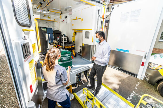 Humza Yousaf is shown around an ambulance by student paramedic Lizzie Hilton in Dundee in July