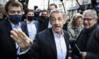 Former French president Nicolas Sarkozy greets his supporters, ahead of a signing session for his new book Promenades.