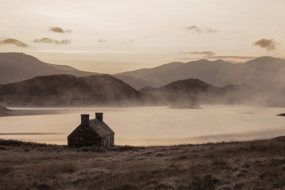 Fog hovers over Loch Stack, near a lone bothy, in Sutherland in an amazing image captured by photographer Richard Gaston during gruelling Cape Wrath trek