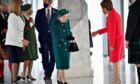 The Queen is greeted by Nicola Sturgeon as she arrives at Holyrood yesterday