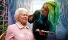 Emma Meehan puts the finishing touches to a wax figure of the Queen at Madame Tussauds last week in Blackpool