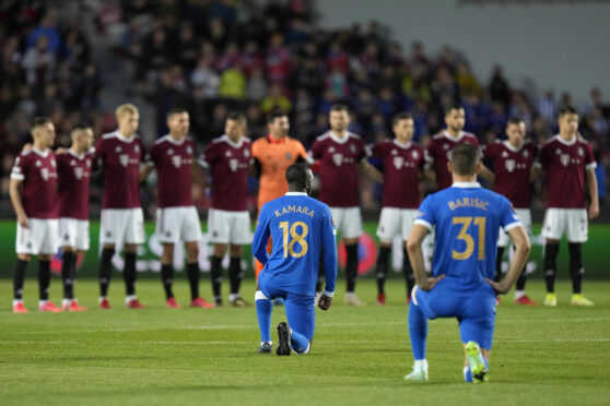 Glen Kamara and Borna Barisic take the knee ahead of the Sparta game