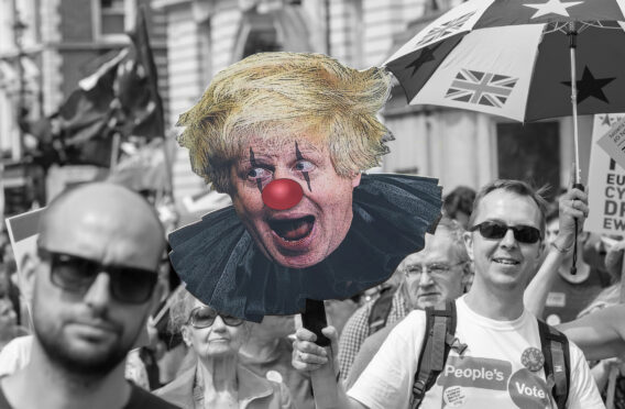 Pro-EU protesters march on Whitehall in 2018, with a caricature of Boris Johnson as a clown – how his persona is perceived by some critics.