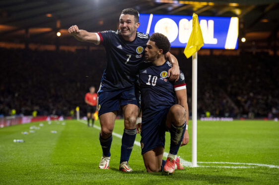 Che Adams and John McGinn celebrate Scotland's second goal against Denmark