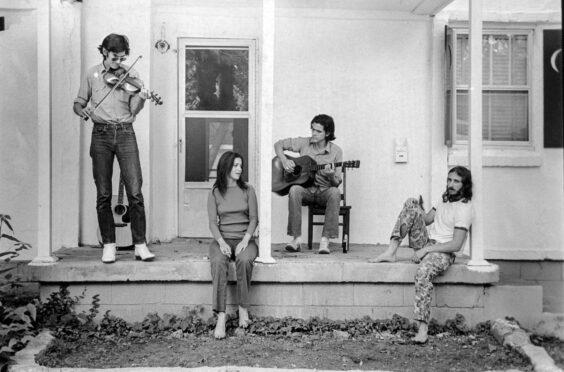 Townes Van Zandt on fiddle, far left, with fellow songwriters Susanna and Guy Clark and Daniel Antopolsky at the Clarks’ Nashville home in 1972.