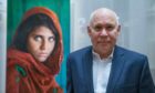 Steve McCurry with his famous image (Pic: Stephanie Lecocq/EPA/Shutterstock)