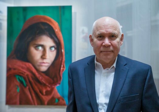 Steve McCurry with his famous image (Pic: Stephanie Lecocq/EPA/Shutterstock)
