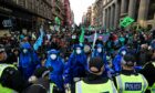 Extinction Rebellion protestors march though the city centre