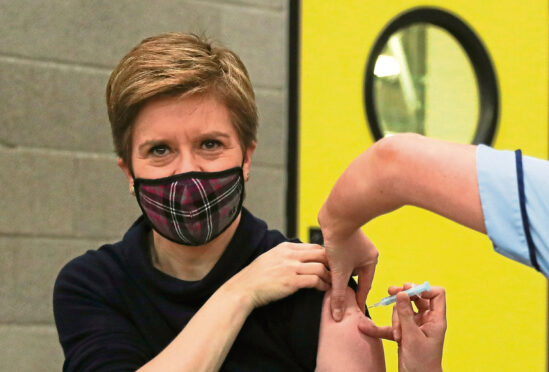 First Minister of Scotland Nicola Sturgeon receives her booster jab of the coronavirus vaccine in Glasgow.