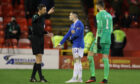 Ryan Kent gets his marching orders from referee Kevin Clancy at Pittodrie last Tuesday night